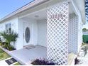 Inviting exterior featuring a welcoming front porch at 22239 Midway Blvd, Port Charlotte, FL 33952