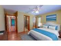 Cozy bedroom with hardwood floors, a comfortable bed, and ample closet space at 7263 Sablon Rd, North Port, FL 34291