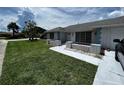Brick ranch home with gray roof, landscaping, and walkway at 4419 Crews Ct, Port Charlotte, FL 33952