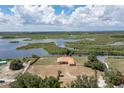 Aerial view of a waterfront property with a large backyard at 37461 Washington Loop Rd, Punta Gorda, FL 33982