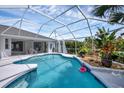 Relaxing screened pool and patio area, perfect for outdoor entertaining at 22098 Bingham Ave, Port Charlotte, FL 33954