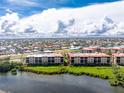 Aerial view of waterfront condo building from another angle at 85 Vivante Blvd # 8534, Punta Gorda, FL 33950