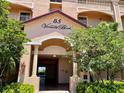 Condo building entrance with address and landscaping at 85 Vivante Blvd # 8534, Punta Gorda, FL 33950