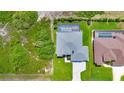 Aerial view of a single-Gathering home with a pool and landscaped yard at 9978 Audrey St, Port Charlotte, FL 33981