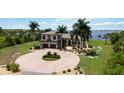 Mediterranean-style home on waterfront lot with circular driveway at 13001 Eleanor Ave, Port Charlotte, FL 33953