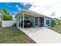 The front exterior featuring an attached carport at 22062 Marshall Ave, Port Charlotte, FL 33952