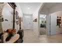 Bright and airy entryway with tile flooring and access to other rooms at 27441 Natal Dr, Punta Gorda, FL 33983