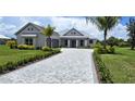 Stunning curb appeal with landscaping and a paved driveway at 28976 Gin Ln, Punta Gorda, FL 33982