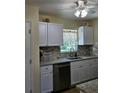 Newly remodeled kitchen with granite countertops and stainless steel appliances at 1286 Hillcrest Nw Ave, Port Charlotte, FL 33948