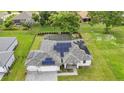 Aerial view of a single-Gathering home with solar panels, pool, and landscaped yard at 16195 Maya Cir, Punta Gorda, FL 33955