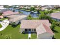 Aerial view of the property showcasing its location by the canal at 695 Coronado Dr, Punta Gorda, FL 33950