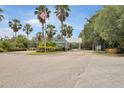Community entrance with flag and landscaping at 2140 Heron Lake Dr # 204, Punta Gorda, FL 33983