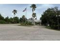 Gated community entrance with flag and signage at 2140 Heron Lake Dr # 204, Punta Gorda, FL 33983