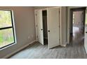 Bedroom with double door closet and tile floors at 13460 Tolman Ave, Port Charlotte, FL 33953