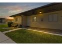Light beige condo building exterior with walkway and landscaping at 25275 Rampart Blvd # 2001, Punta Gorda, FL 33983