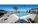 Refreshing community pool with ample seating at 3251 White Ibis Ct # A4, Punta Gorda, FL 33950