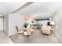Bright dining area with glass table and wicker chairs at 3251 White Ibis Ct # A4, Punta Gorda, FL 33950