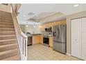 Modern kitchen with stainless steel appliances and light wood cabinets at 1186 Rio De Janeiro Ave # 104, Punta Gorda, FL 33983