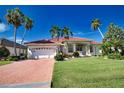 Beautiful home with red tile roof and palm trees at 2259 Ryan Blvd, Punta Gorda, FL 33950