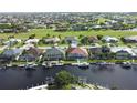 Community view, waterfront homes with boats at 2259 Ryan Blvd, Punta Gorda, FL 33950