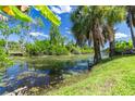 Peaceful view of a canal with lush greenery at 1516 Natrona Dr, North Port, FL 34286