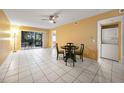 Condo living room with tile floors, table and chairs, and sliding door at 25050 Sandhill Blvd # A4 Bldg 2, Punta Gorda, FL 33983