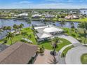 Luxury waterfront home with circular driveway and lush landscaping at 374 Severin Se Rd, Port Charlotte, FL 33952