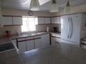 Spacious kitchen with ample counter space and white cabinets at 5505 Holiday Park Blvd, North Port, FL 34287