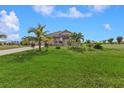 One-story house with palm trees and a large front yard at 17314 Cape Horn Blvd, Punta Gorda, FL 33955