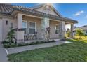 Front view of a single story home with a covered porch and landscaped yard at 17314 Cape Horn Blvd, Punta Gorda, FL 33955