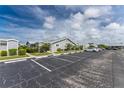 Exterior view of villa with parking and landscaping at 3300 Loveland Boulevard # 1904, Port Charlotte, FL 33980