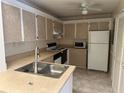 Efficient kitchen with white appliances at 3300 Loveland Blvd # 2903, Punta Gorda, FL 33980