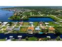 Aerial view showcasing a canal-front house with a pool and private dock at 5149 Latham Ter, Port Charlotte, FL 33981
