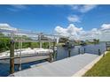 Private boat dock with a covered lift and access to a waterway at 5149 Latham Ter, Port Charlotte, FL 33981