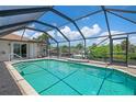 Enclosed pool and patio area offering privacy and views of the canal at 5149 Latham Ter, Port Charlotte, FL 33981