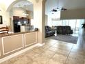 Open floor plan with kitchen, living and dining areas at 530 Kensington St, Port Charlotte, FL 33954