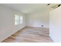Spacious living room with light flooring, high ceilings, and ample natural light at 20340 Zelda Ave, Port Charlotte, FL 33952