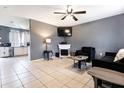 Spacious living room with fireplace and kitchen view at 5104 Chaves Cir, Port Charlotte, FL 33948