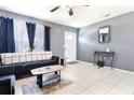 Bright living room with tile floors and comfy seating at 5104 Chaves Cir, Port Charlotte, FL 33948