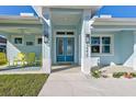 Inviting front porch with yellow rocking chairs, perfect for relaxing at 2239 Cornelius Blvd, Port Charlotte, FL 33953
