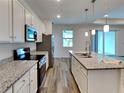 Modern kitchen with stainless steel appliances and granite countertops at 16216 Minorca Dr, Punta Gorda, FL 33955