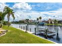 Scenic waterfront view featuring a private dock and boat lift on a beautiful canal at 2807 Via Paloma Dr, Punta Gorda, FL 33950
