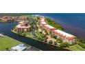 Aerial view of waterfront community, highlighting building location and landscaping at 85 Vivante Blvd # 8524, Punta Gorda, FL 33950