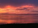 Stunning sunset over calm water, offering serene waterfront views at 85 Vivante Blvd # 8524, Punta Gorda, FL 33950