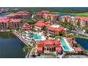 Aerial view of community with pools and tennis courts at 85 Vivante Blvd # 8524, Punta Gorda, FL 33950