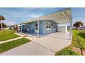 Newly renovated home with a carport and spacious backyard at 8724 Agress Ave, North Port, FL 34287