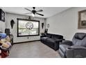 Living room with gray couch and recliner at 481 Ricold Ter, Port Charlotte, FL 33954