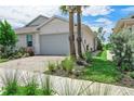 Home exterior showcasing landscaping and driveway at 43614 Sparrow Dr, Punta Gorda, FL 33982