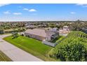 Single-story home with pool, screened enclosure, and spacious backyard at 14176 Saul Ln, Port Charlotte, FL 33981