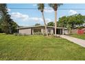 Mid-century modern home with a spacious yard at 1642 Banyan Dr, Venice, FL 34293